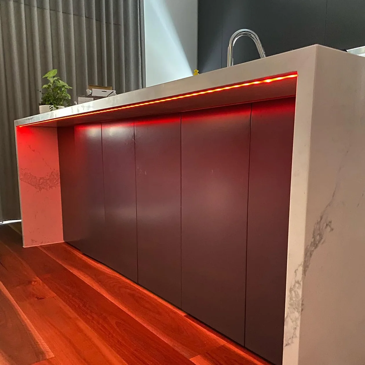 Kitchen island with integrated backlighting