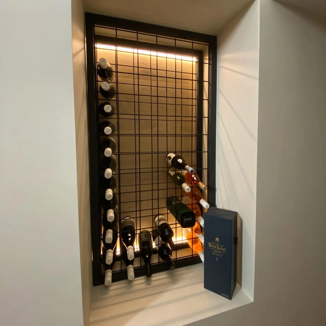 Backlit wine display built into joinery