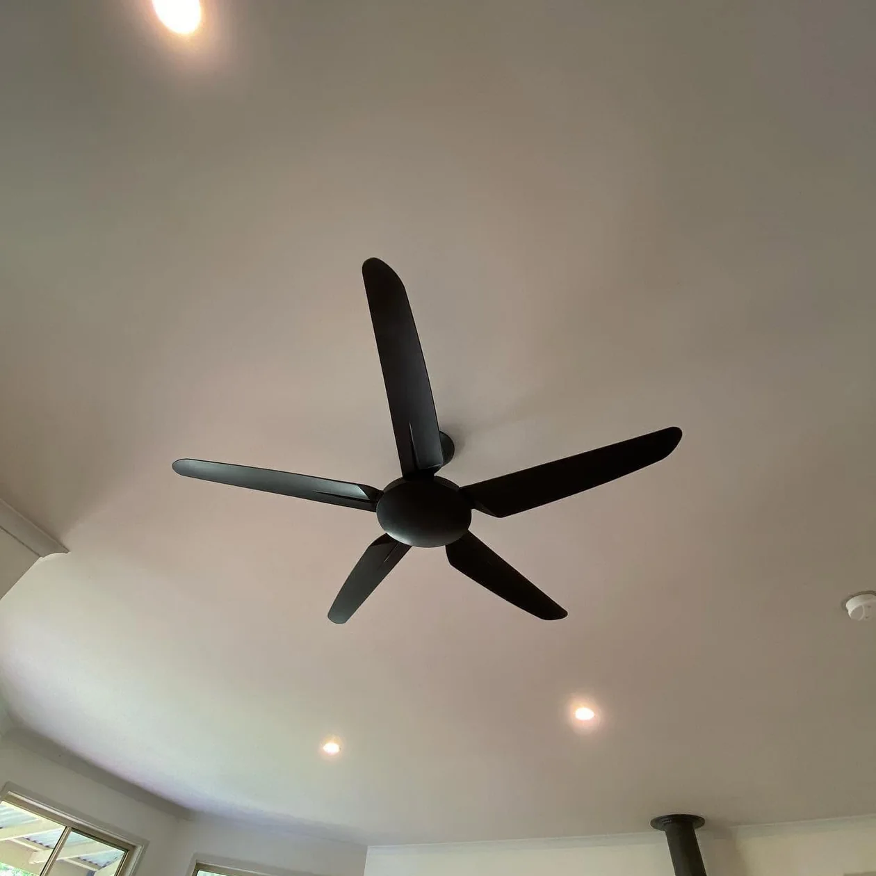 Ceiling fan installed and running in a room