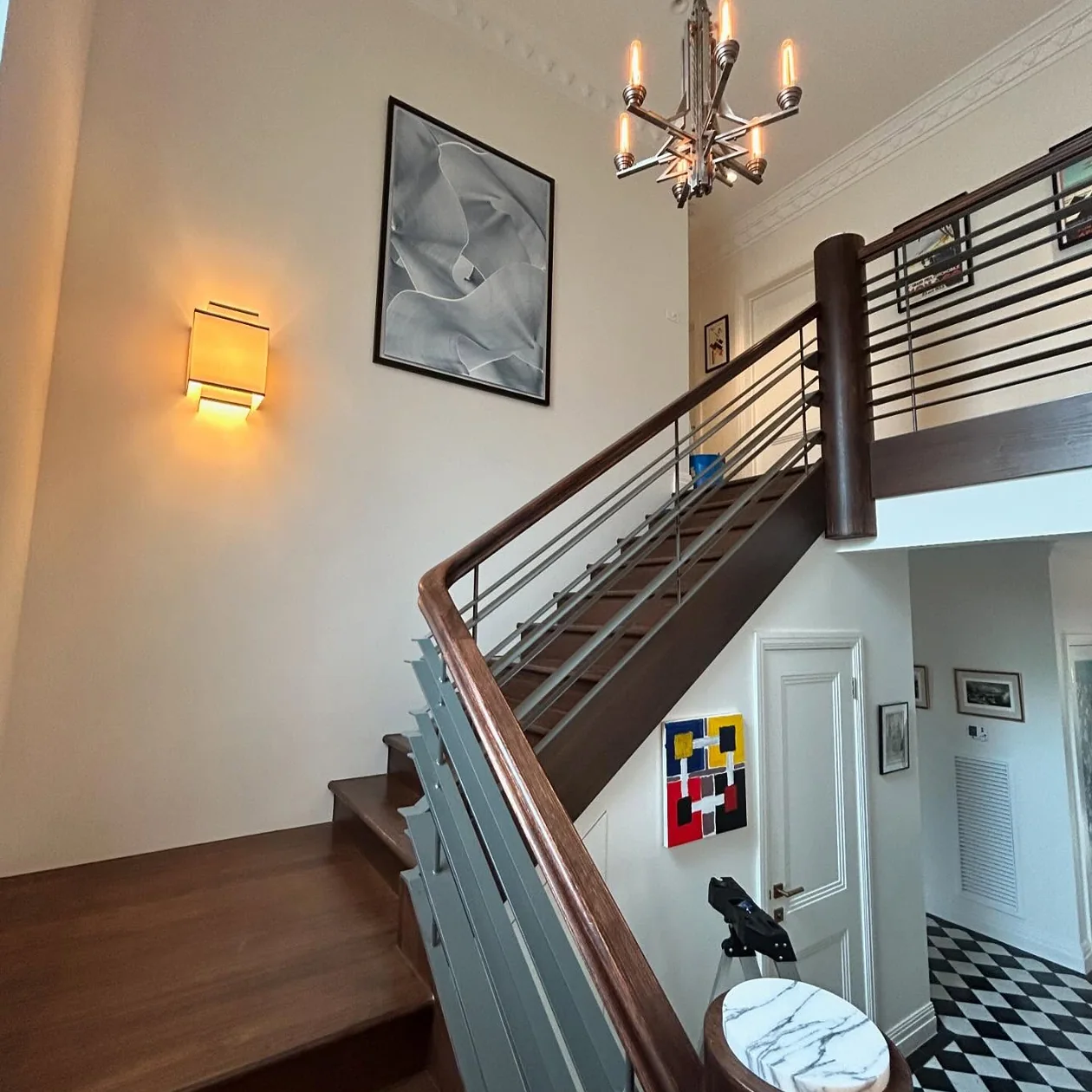 Chandelier installed in a period home stairwell