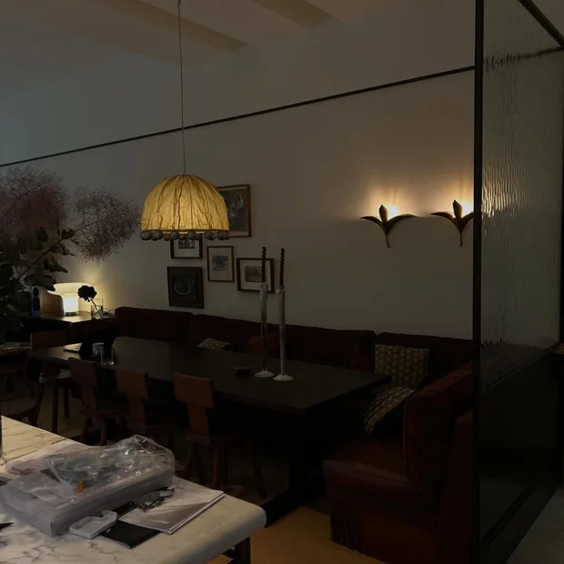 Feature lighting above restaurant booth seating