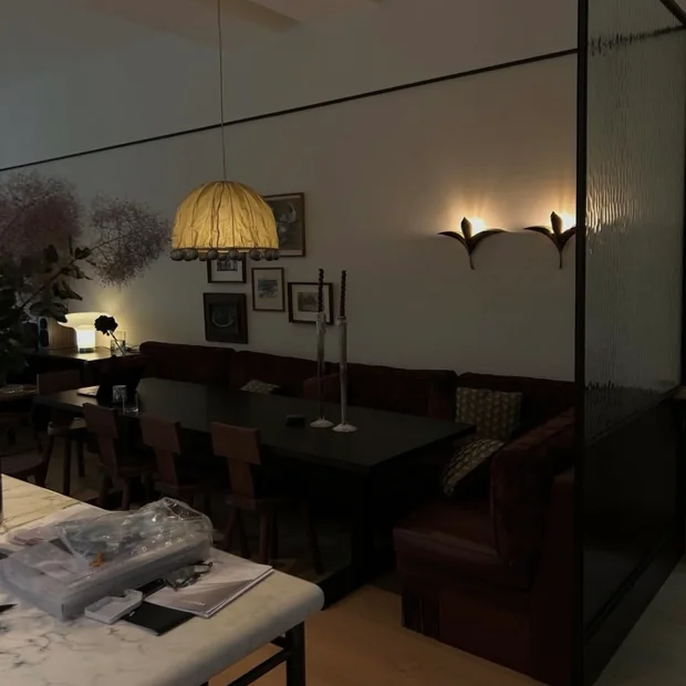 Restaurant seating with wall and pendant lighting