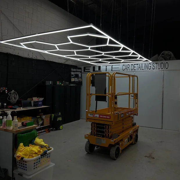 Workshop with overhead LED lighting installed