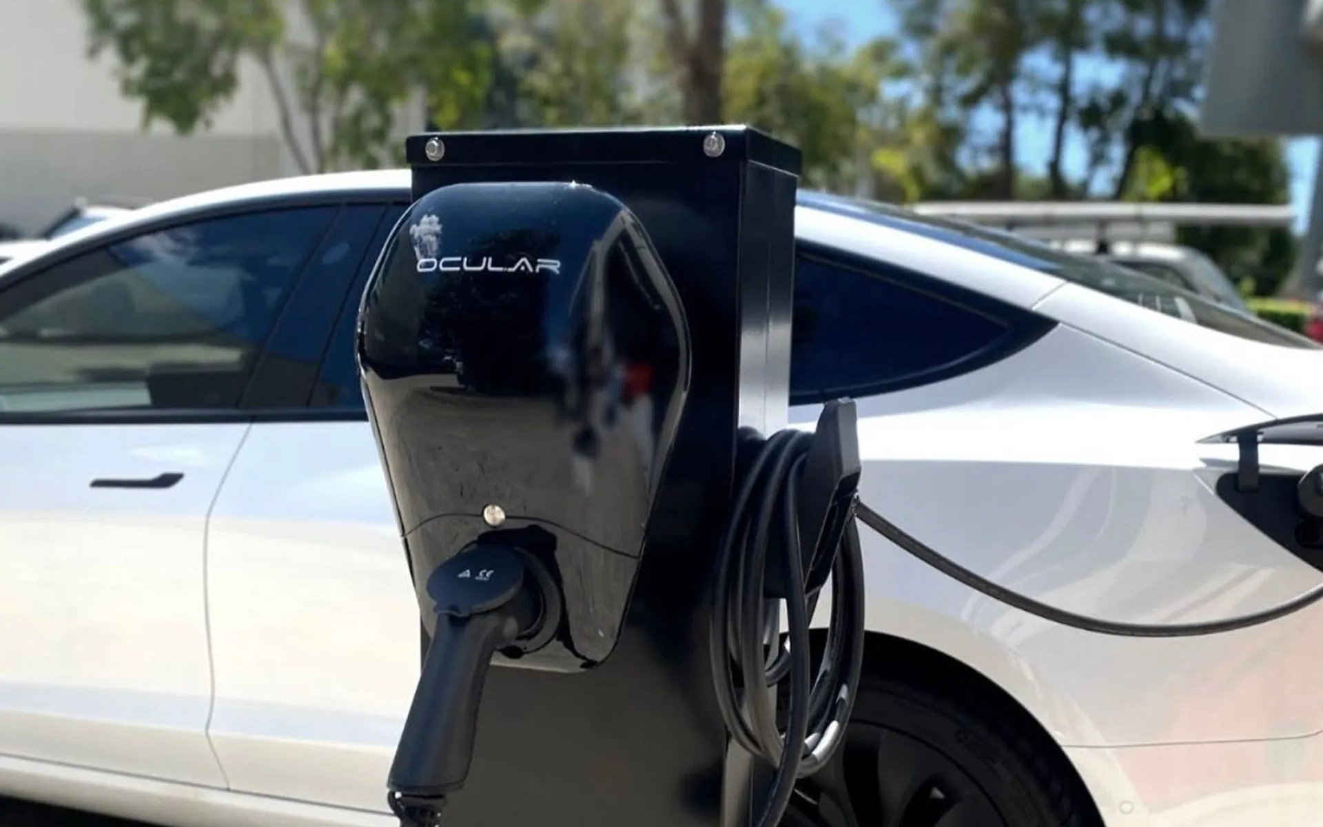 EV charger installed beside a parked electric car