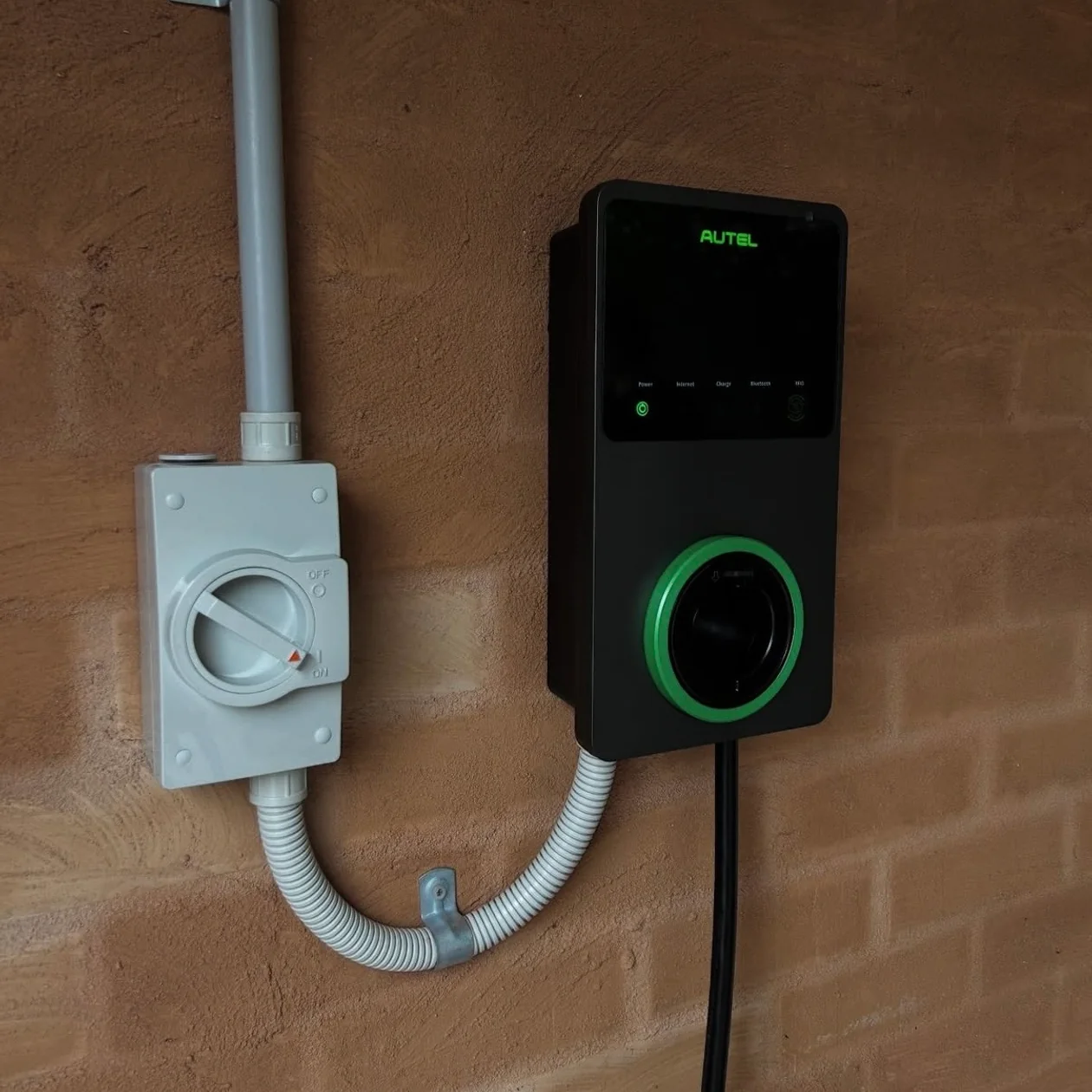 Isolator fitted beside an EV charger