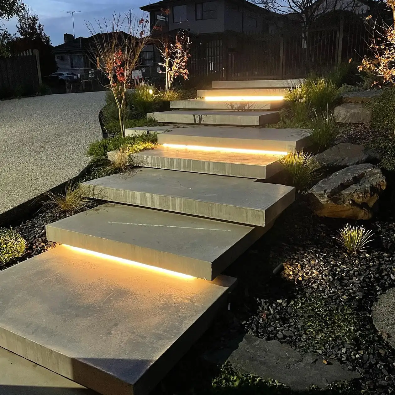 Lit garden steps on a sloping property