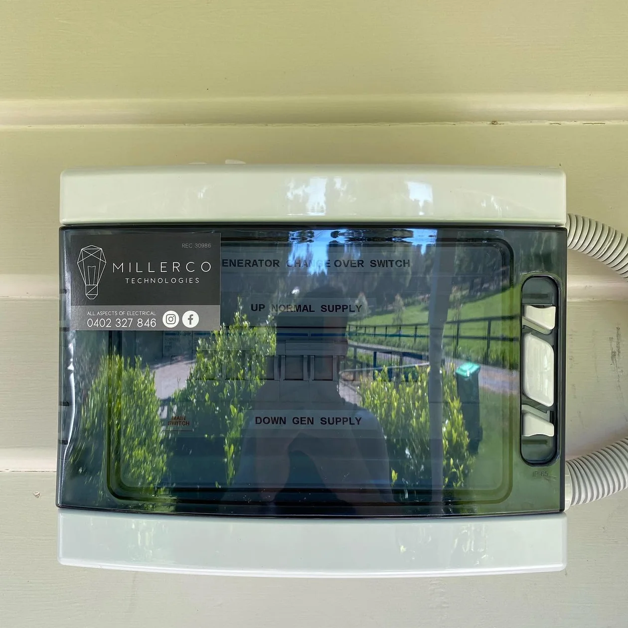 Electrical enclosure and changeover switch installed at a property