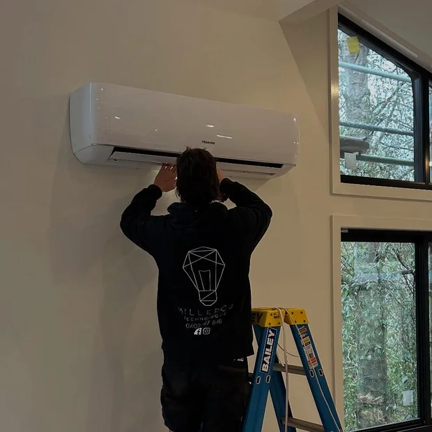 MillerCo electrician working inside a home