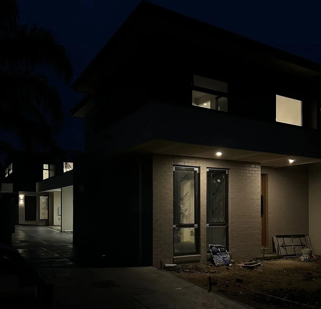 Home exterior lit at night