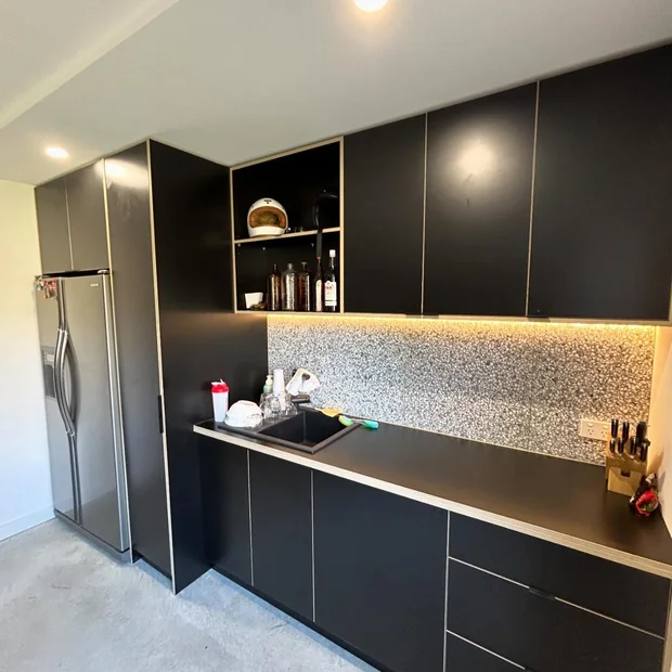 Under-cabinet lighting in a dark kitchen