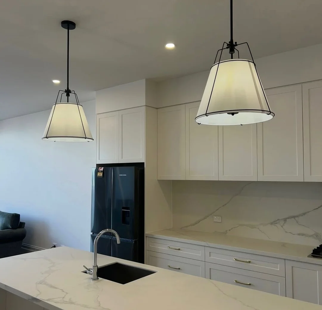 Pendant lights installed over a kitchen bench