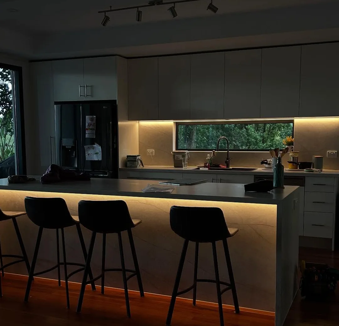 Kitchen with LED strip lighting under the island and benchtop