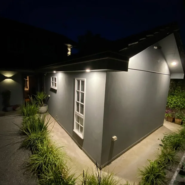 Exterior wall lights on a house at night