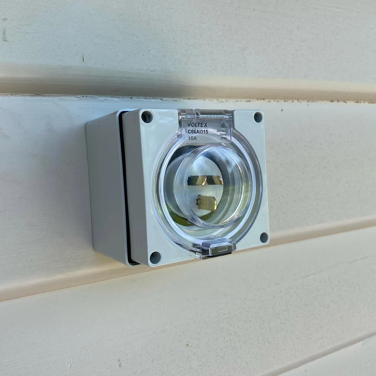 Weatherproof outdoor powerpoint installed on a wall