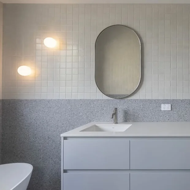 Finished bathroom with vanity lighting