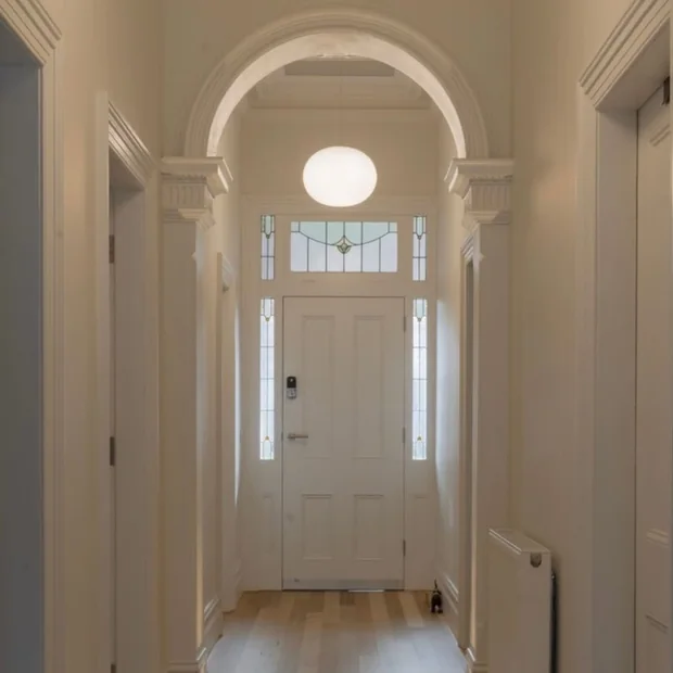 Hallway with an arched ceiling light