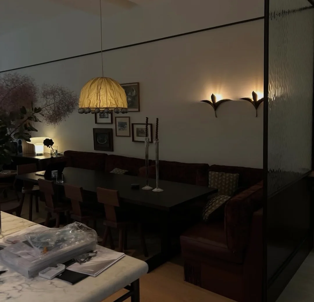 Feature lighting above restaurant booth seating