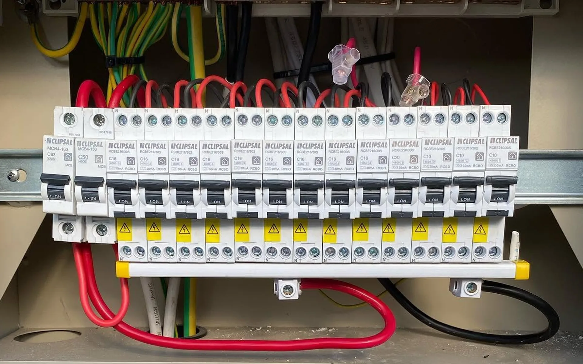 Upgraded residential switchboard with new circuit breakers and safety switches